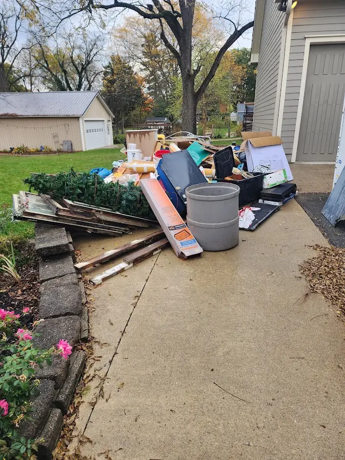 Dumpster being loaded with debris for Commercial Dumpster Rental in Arbutus